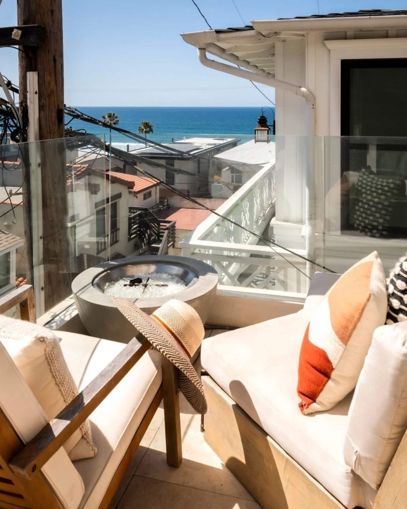 Airbnb property management in Los Angeles, rooftop lounge with fire pit and ocean view